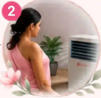 Woman seated in front of a cooling unit in a private room before thermal imaging
